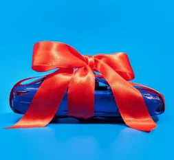 gift-car-wrapped-ribbon-bow-600nw-2347999867